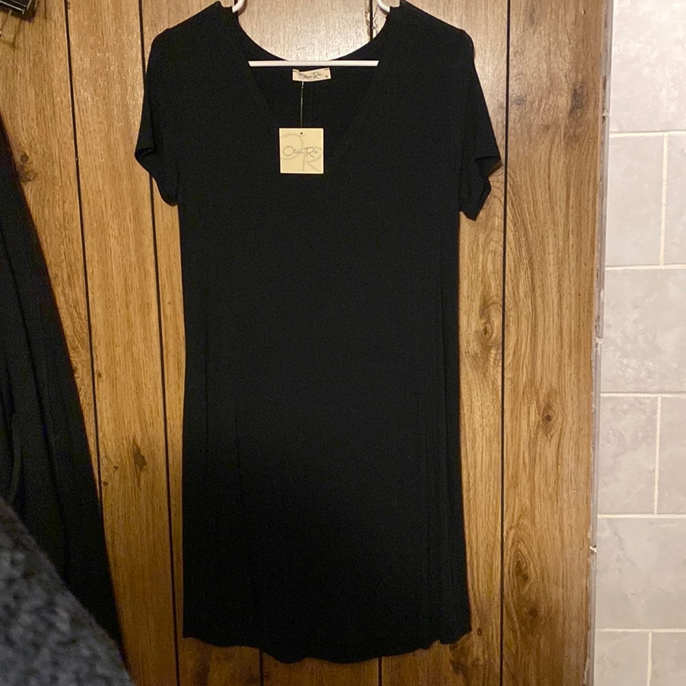 Woman’s short sleeve black dress. NWT. Size M.